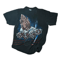 a black t - shirt with a rose on it