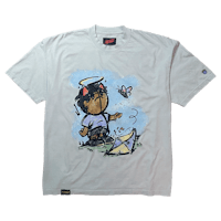 a white t - shirt with a cartoon character on it